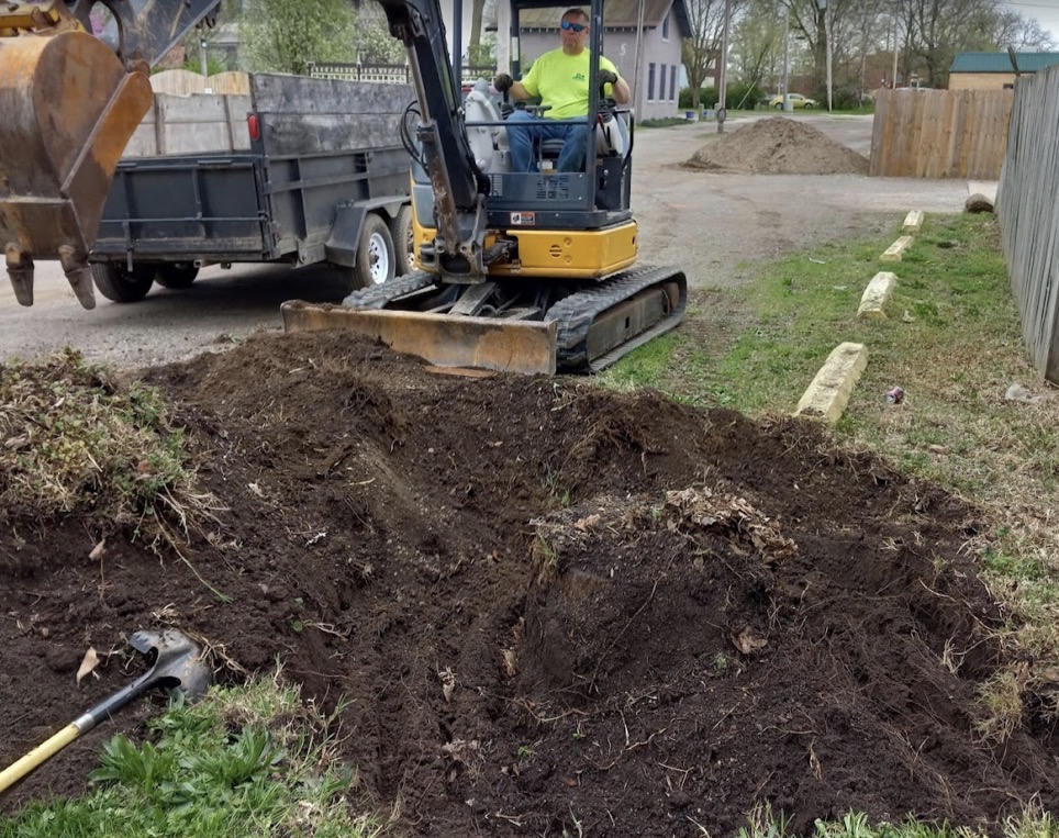 Bellaire Lawn Care excavator work on a local landscaping project